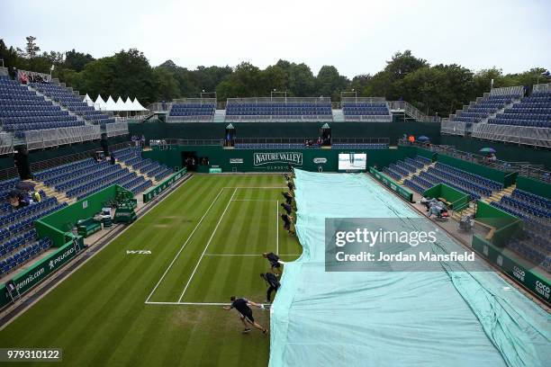 Groundstaff pull the covers on as rain delays play on Day Five of the Nature Valley Classic at Edgbaston Priory Club on June 20, 2018 in Birmingham,...