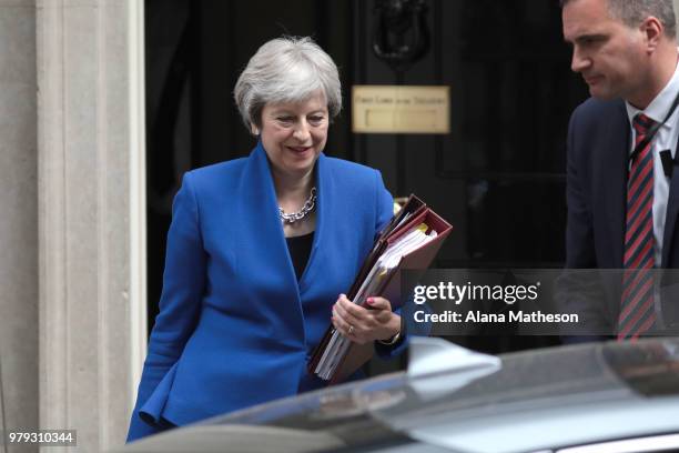 Prime Minister Theresa May leaves Downing Street ahead of Prime Minister's Questions on June 20, 2018 in London, England. MPs vote today on the...