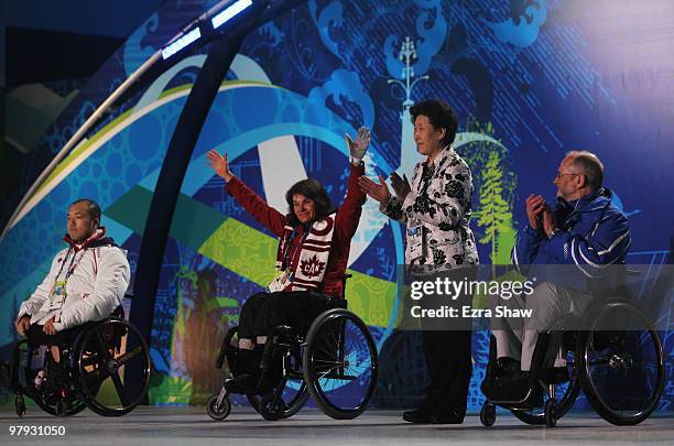 The Whang Youn Dai achievement award is presented to Paralympians Takayuki Endo and Colette Bourgonje in the presence of Sir Philip Craven and Whang...