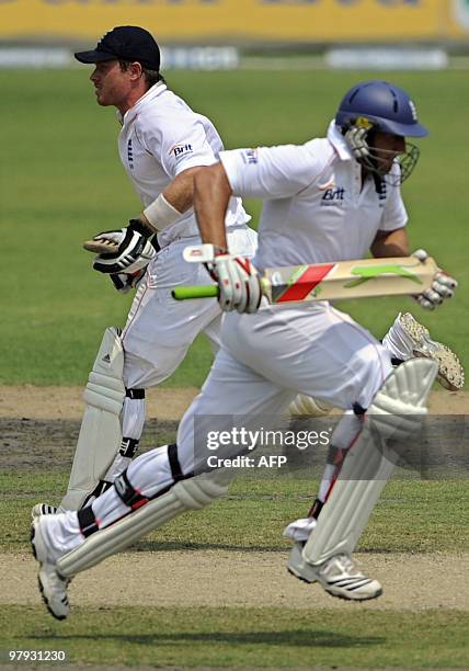 England cricketers Tim Bresnan and Ian Bell run between the wickets during the third day of the second Test match between Bangladesh and England at...