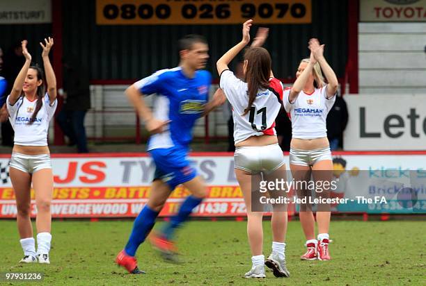 Players run past the Stevenage Borough cheerleaders during the Stevenage Borough and Kidderminster Harriers FA Trophy Cup Semi Final 2nd leg match at...