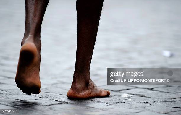 Ethiopian Siraj Gena's walks barefoot after winning the 16th Rome Marathon 'Maratona di Roma' on March 21, 2010.Gena arrived barefoot in memory of...