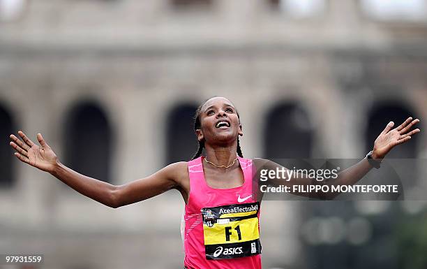 Ethiopian Firehiwot Dado Tufa celebrates as she crosses the finish line after winning the 16th Rome Marathon 'Maratona di Roma' on March 21, 2010....