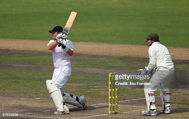 England batsman Ian Bell hits a ball to the boundary watched by wicketkeeper Mushfiqur Rahim during day three of the 2nd Test match between...
