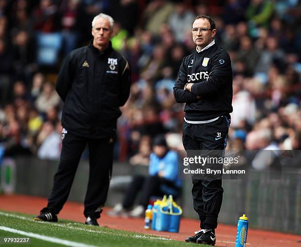 Aston Villa Manager Martin O'Neill and Wolves Manager Mick McCarthy watch the Barclays Premier League match between Aston Villa and Wolverhampton...