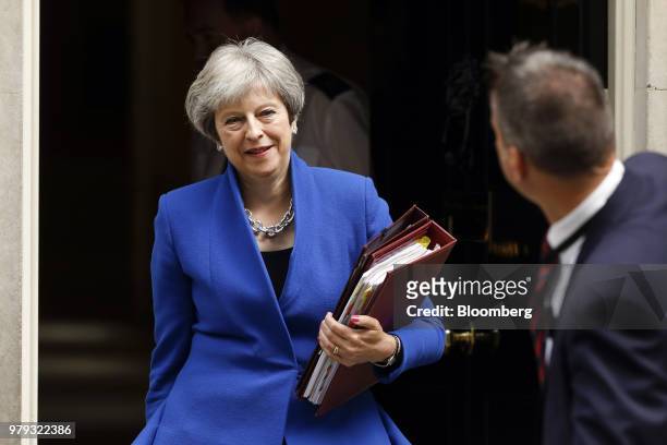 Theresa May, U.K. Primer minister, departs number 10 Downing Street to attend a weekly questions and answers session in Parliament in London, U.K.,...