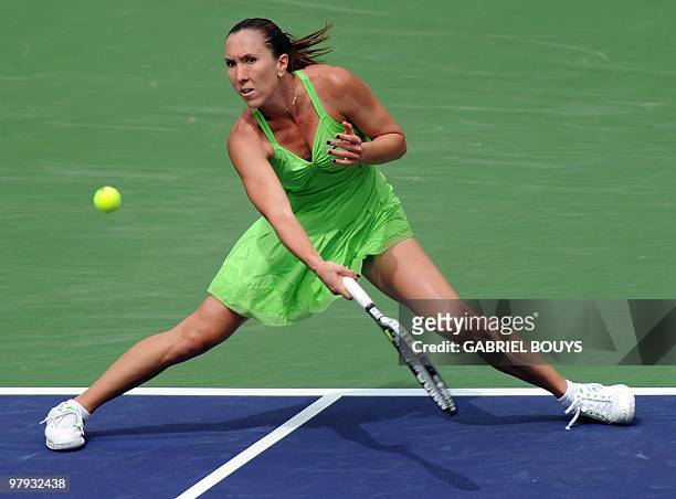 Jelena Jankovic of Serbia returns a shot to Caroline Wozniacki of Denmark during the final of the BNP Paribas Open on March 21, 2010 at the Indian...