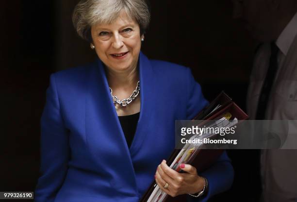 Theresa May, U.K. Prime minister, departs number 10 Downing Street to attend a weekly questions and answers session in Parliament in London, U.K., on...