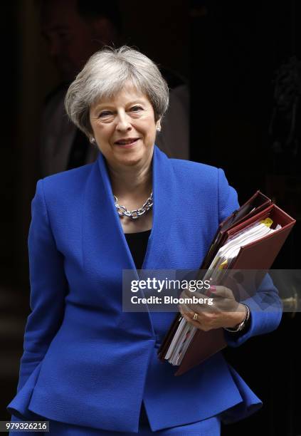 Theresa May, U.K. Prime minister, departs number 10 Downing Street to attend a weekly questions and answers session in Parliament in London, U.K., on...