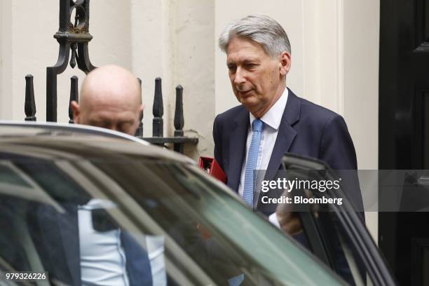 Philip Hammond, U.K. Chancellor of the exchequer, departs number 11 Downing Street to attend a weekly questions and answers session in Parliament in...