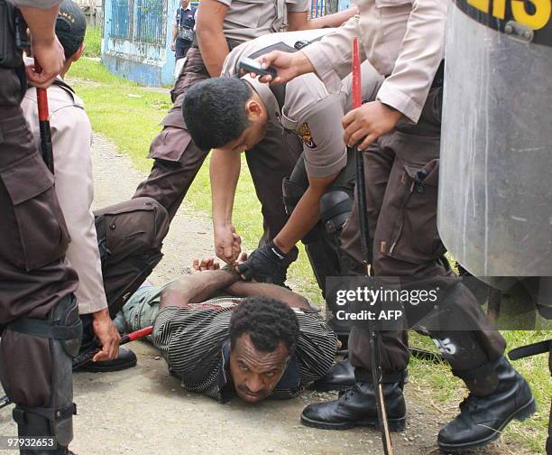 Police arrest a Papuan pro-separatist demonstrators in Jayapura on March 22, 2010 during a rally calling the attention of US President Barack Obama...