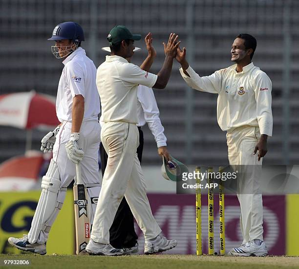 Bangladeshi cricket captain Shakib Al Hasan celebrates with teammate Mohammad Mahmudullah after the dismissal of England cricketer Graeme Swann...