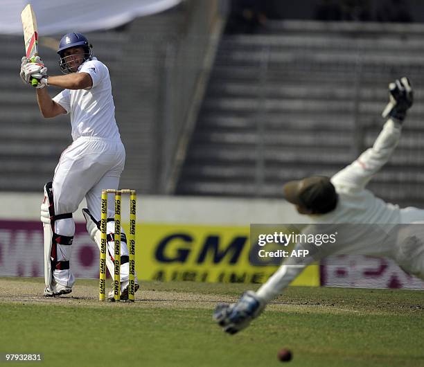 England cricketer Tim Bresnan plays a shot as Bangladeshi cricketer Mushfiqur Rahim tries to reach the ball during the third day of the second Test...