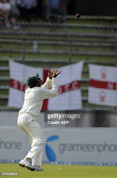 Bangladeshi cricketer Jahurul Islam takes the catch of England cricketer Ian Bell during the third day of the second Test match between Bangladesh...