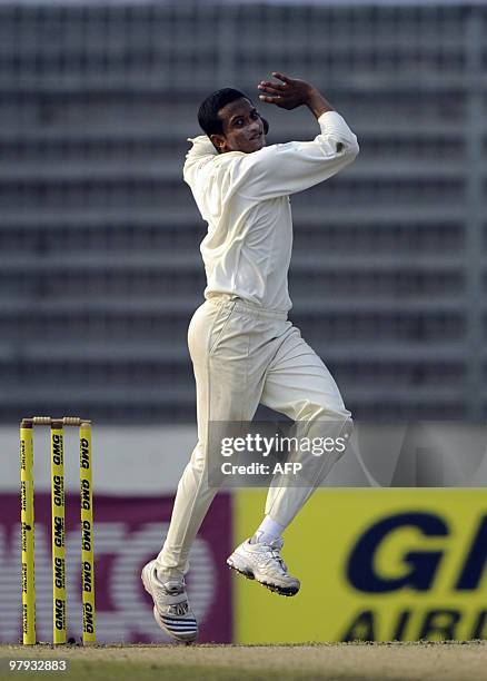 Bangladeshi cricket captain Shakib Al Hasan delivers a ball during the third day of the second Test match between Bangladesh and England at the...