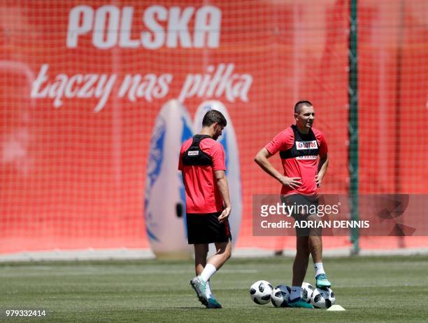 Poland's defender Artur Jedrzejczyk and forward Dawid Kownacki take part in a training session at the Sputnik sports center in Sochi on June 20, 2018...