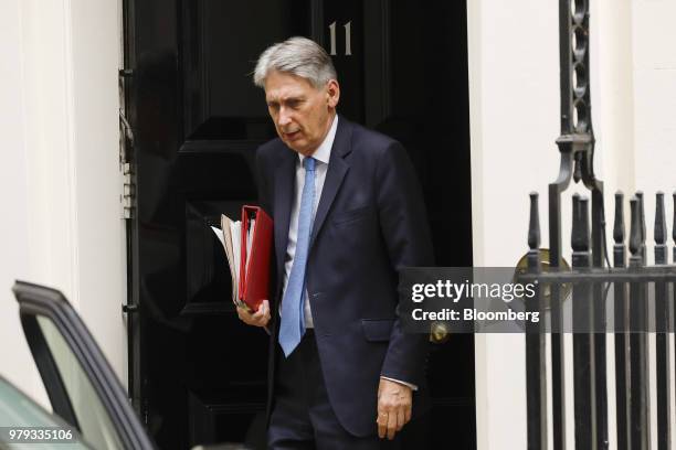 Philip Hammond, U.K. Chancellor of the exchequer, departs number 11 Downing Street to attend a weekly questions and answers session in Parliament in...