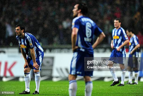 Marc Pfertzel and Christian Fuchs of Bochum look dejected during the Bundesliga match between SV Werder Bremen and VfL Bochum at Weser Stadium on...