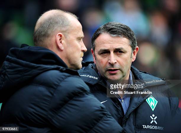 Thomas Schaaf, Head Coach of Bremen talks with Klaus Allofs, Sports Director of Bremen during the Bundesliga match between SV Werder Bremen and VfL...