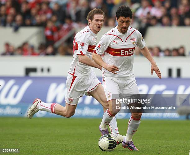 Ciprian Marica of Stuttgart and his team mate Aliaksandr Hleb run with the ball during the Bundesliga match between VfB Stuttgart and Hannover 96 at...