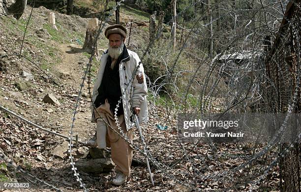 Gulzar Ahmad 45, a double amputee lost both legs eight years ago when he stepped on a landmine while herding his cattle, on March 22, 2010 in Warsun...