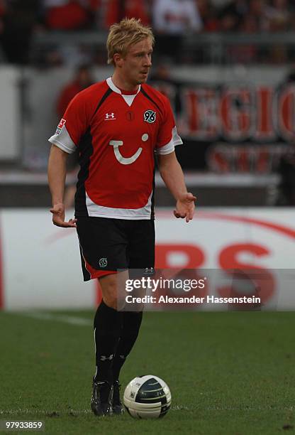 Mike Hanke of Hannover runs with the ball during the Bundesliga match between VfB Stuttgart and Hannover 96 at Mercedes-Benz Arena on March 20, 2010...