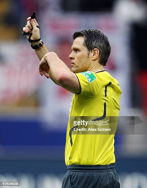 Referee Michael Weiner gestures during the Bundesliga match between Eintracht Frankfurt and Bayern Muenchen at the Commerzbank Arena on March 20,...