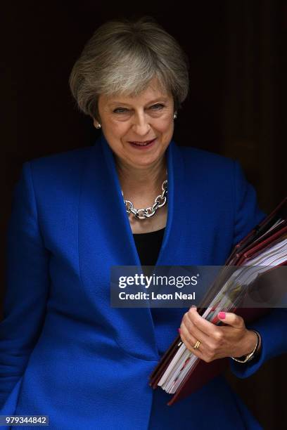 Prime Minister Theresa May leaves Downing Street ahead of Prime Minister's Questions on June 20, 2018 in London, England. MPs vote today on the...