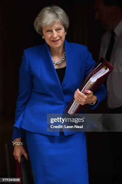 Prime Minister Theresa May leaves Downing Street ahead of Prime Minister's Questions on June 20, 2018 in London, England. MPs vote today on the...