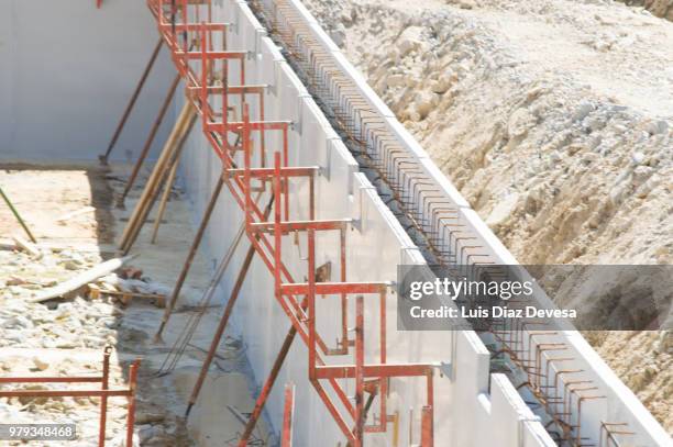 foundation holes at different stages - ferro metal stock pictures, royalty-free photos & images