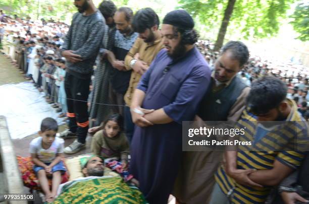 Villagers offer funeral prayers near the body of of 25 years old Aijaz Ahmad Bhat, a civilian who was killed By Indian Army near his Home in Nowpora...