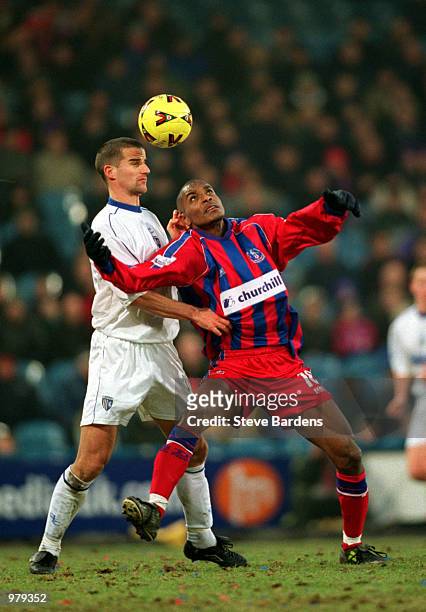 Clinton Morrison of Crystal Palace and Chris Hope of Gillingham challenge for the ball during the Nationwide League Division One League match between...