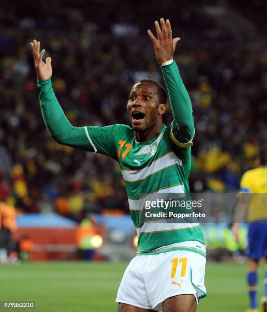 Didier Drogba of the Ivory Coast celebrates after scoring during the FIFA World Cup Group G match between Brazil and the Ivory Coast at the Soccer...