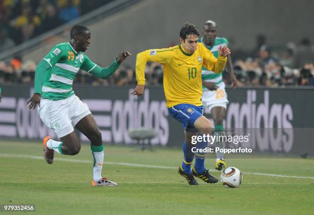 Kaka of Brazil is closed down by Yaya Toure of the Ivory Coast during a FIFA World Cup Group G match at the Soccer City Stadium on June 20, 2010 in...