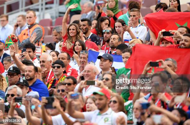 Ana Sofia Gomes, Joao Moutinho's wife waves while Georgina Rodriguez, Cristiano Ronaldo's girlfriend sits next to her during the 2018 FIFA World Cup...