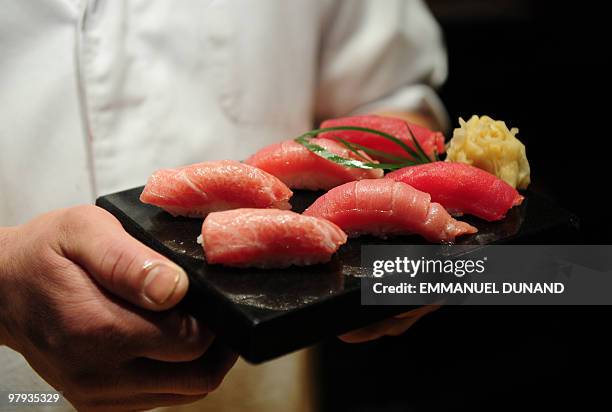 Sushi chef William Tawng displays a sushi selection made from a bluefin tuna at the upscale Japanese restaurant Megu in New York on March 10, 2010....