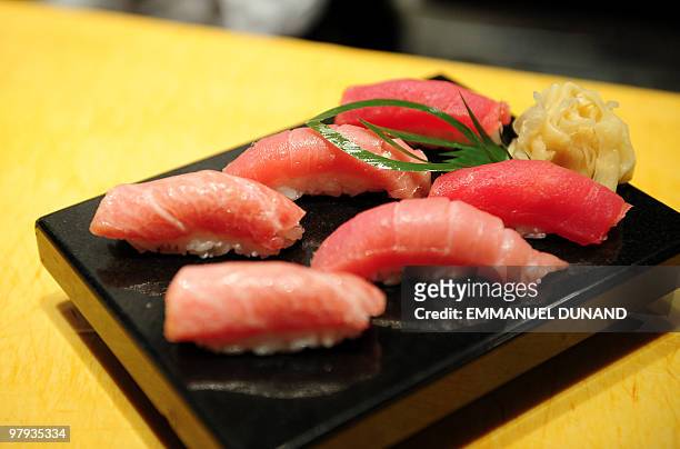 Sushi chef William Tawng displays a sushi selection made from a bluefin tuna at the upscale Japanese restaurant Megu in New York on March 10, 2010....
