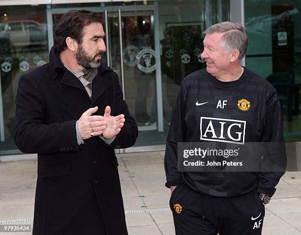 Sir Alex Ferguson of Manchester United meets former player Eric Cantona at Carrington Training Ground on March 22 2010 in Manchester, England.