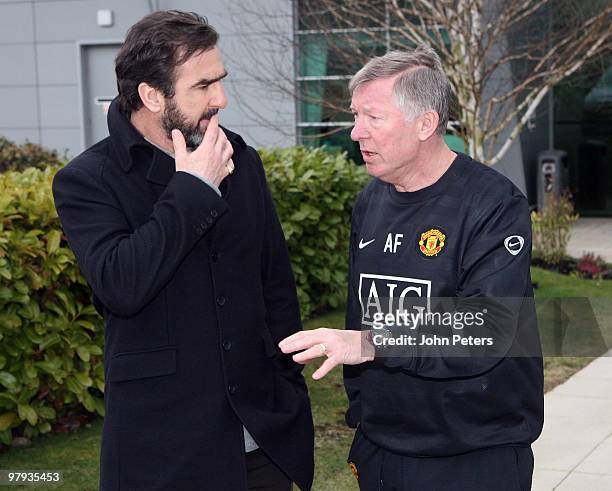 Sir Alex Ferguson of Manchester United meets former player Eric Cantona at Carrington Training Ground on March 22 2010 in Manchester, England.