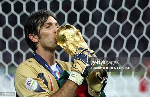 Italian goalkeeper Gianluigi Buffon kisses the trophy after the World Cup 2006 final football game Italy vs.France, 09 July 2006 at Berlin stadium....