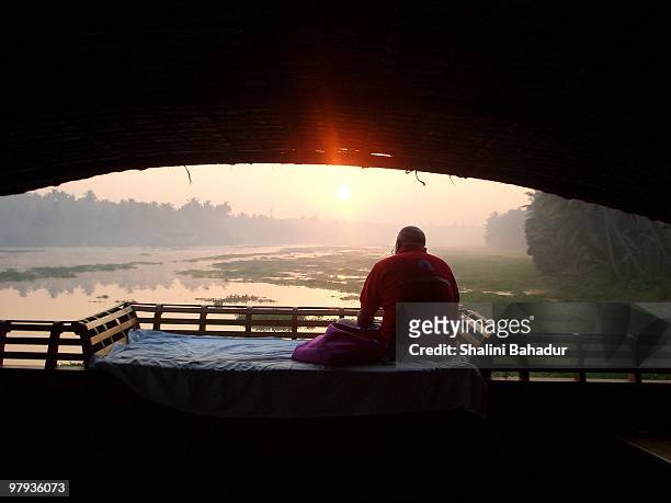 a young man sitting in boat house, kerala - bahadur stock pictures, royalty-free photos & images