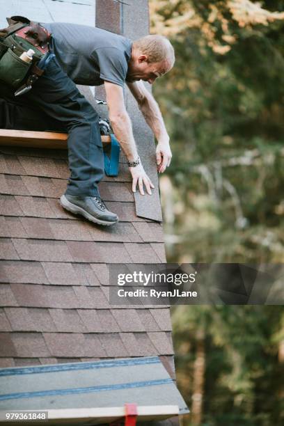 general contractor installing new roof - general maintenance stock pictures, royalty-free photos & images