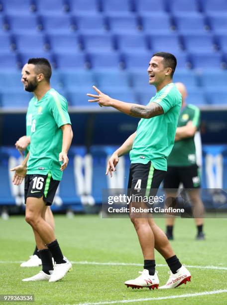 Aziz Behich and Tim Cahill of Australia enjoy an Australia Socceroos training session ahead of the 2018 FIFA World Cup match against Denmark at...