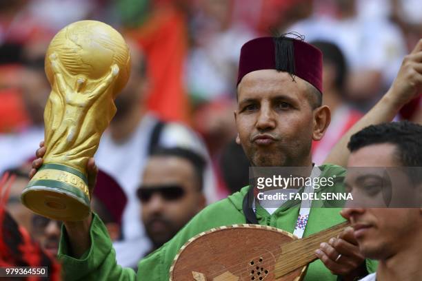 Morocco's fan cheers prior to the Russia 2018 World Cup Group B football match between Portugal and Morocco at the Luzhniki Stadium in Moscow on June...