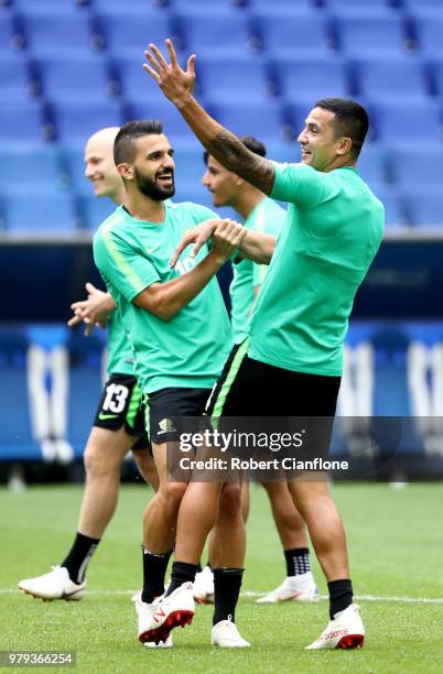 Aziz Behich of Australia jokes with Tim Cahill of Australia during an Australia Socceroos training session ahead of the 2018 FIFA World Cup match...