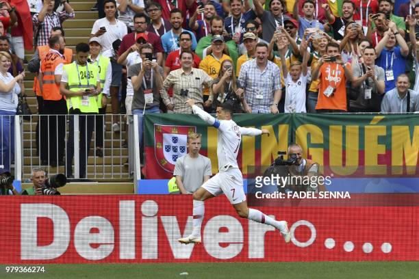 Portugal's forward Cristiano Ronaldo celebrates after scoring a goal during the Russia 2018 World Cup Group B football match between Portugal and...