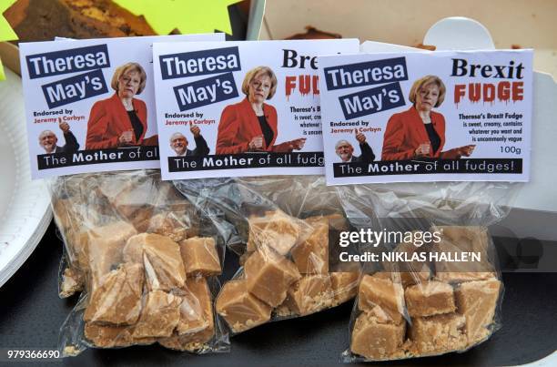 Packets of fudge with labels reading "Theresa May's Brexit Fudge" are pictured during an anti-Brexit demonstration outside the Houses of Parliament...