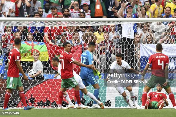 Portugal's forward Cristiano Ronaldo celebrates with teammates after scoring a goal during the Russia 2018 World Cup Group B football match between...