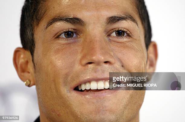 Real Madrid's Portuguese player Cristiano Ronaldo smiles during his press conference on July 16 at the Carton House Hotel, in Maynooth, 22 km from...
