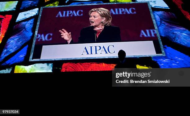 Secretary of State Hillary Rodham Clinton is seen on a screen as she speaks during the 2010 American Israel Public Affairs Committee conference March...